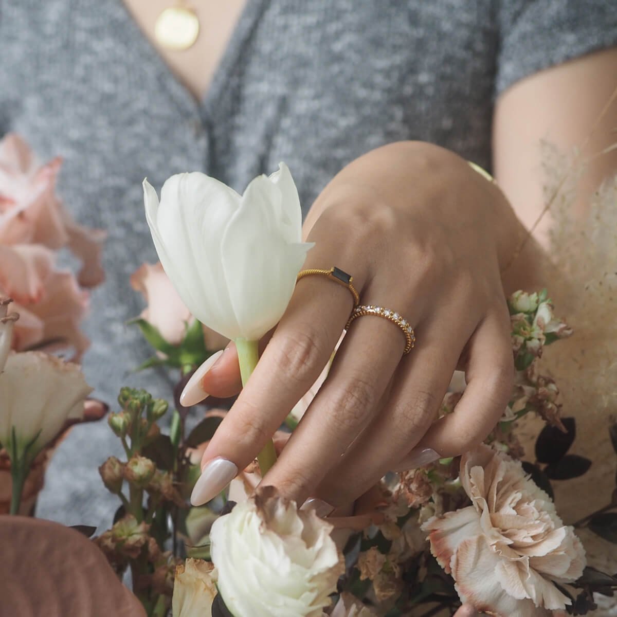 black-zircon-ring-woman-holds-a-white-rose.jpg