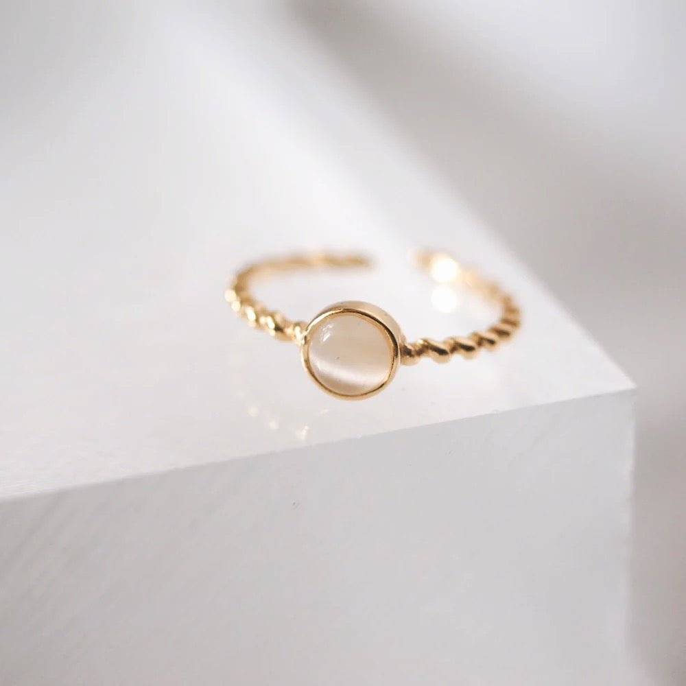 elegant-gold-ring-with-white-opal-stone.jpg